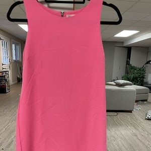 Vintage mini dress with scalloped skirt edge.